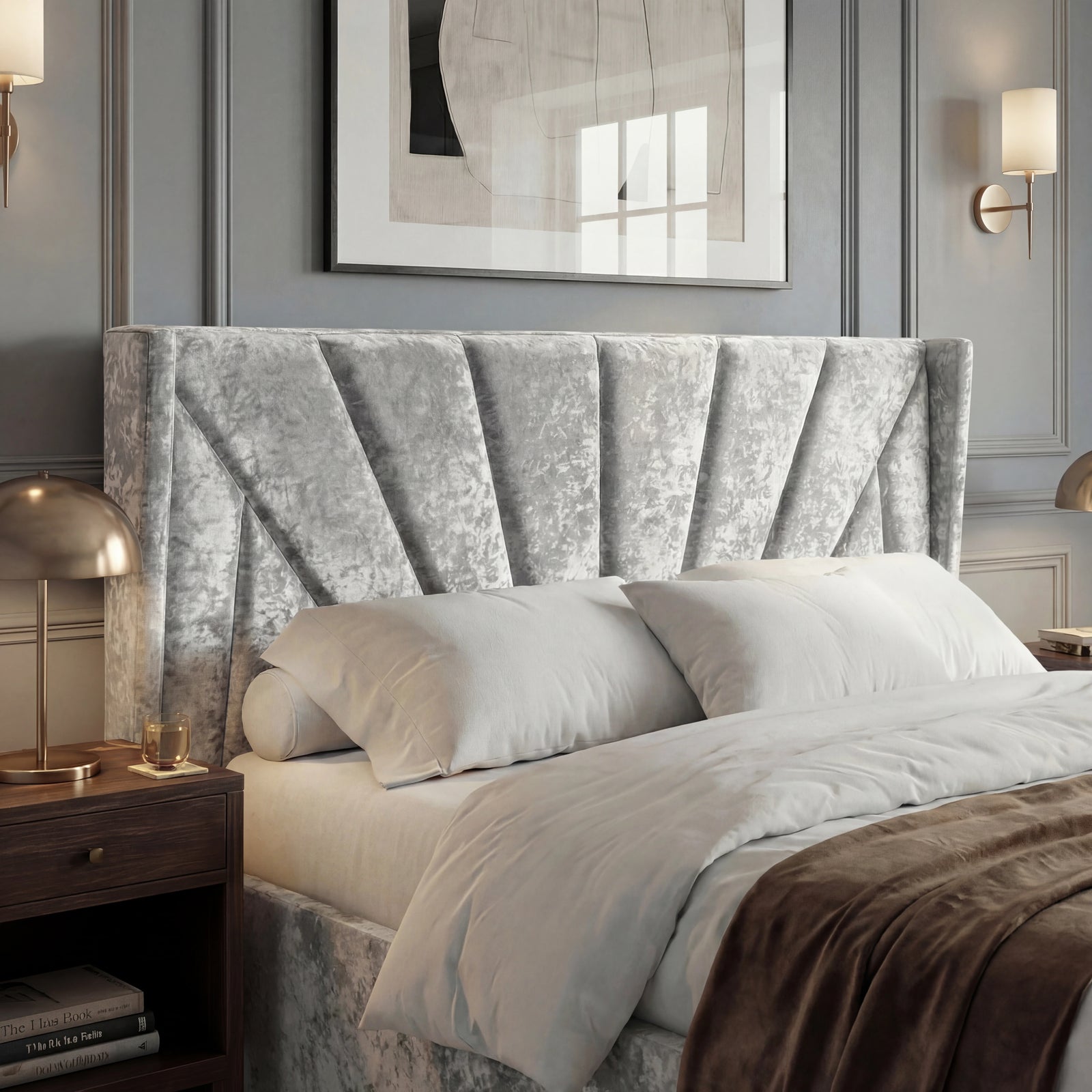 [Small Double | Silver] Close view of Sunrise wing headboard with pleated panels, pillows, and brass bedside lamp