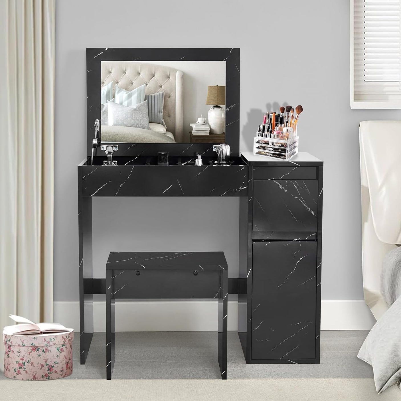 Small dressing table with flip-up mirror and stool in black marble finish, featuring built-in storage and makeup organizer for modern bedrooms.