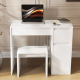 White desk with a laptop and small stool in a room with wooden flooring and beige walls.