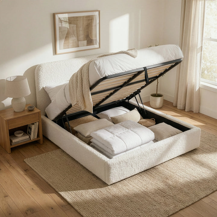 [White | Double] Double boucle ottoman bed open, gas-lift mechanism exposing full-size storage cavity.