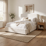 [White | King] Sofna boucle ottoman bed king angled, full boucle frame with oak nightstand and layered rugs