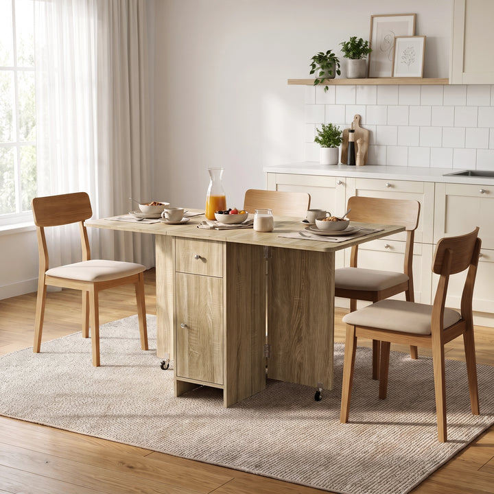 [Sonoma Oak] Wood-effect folding dining table fully opened and styled with four chairs, fruit, cups and a milk jug on top.