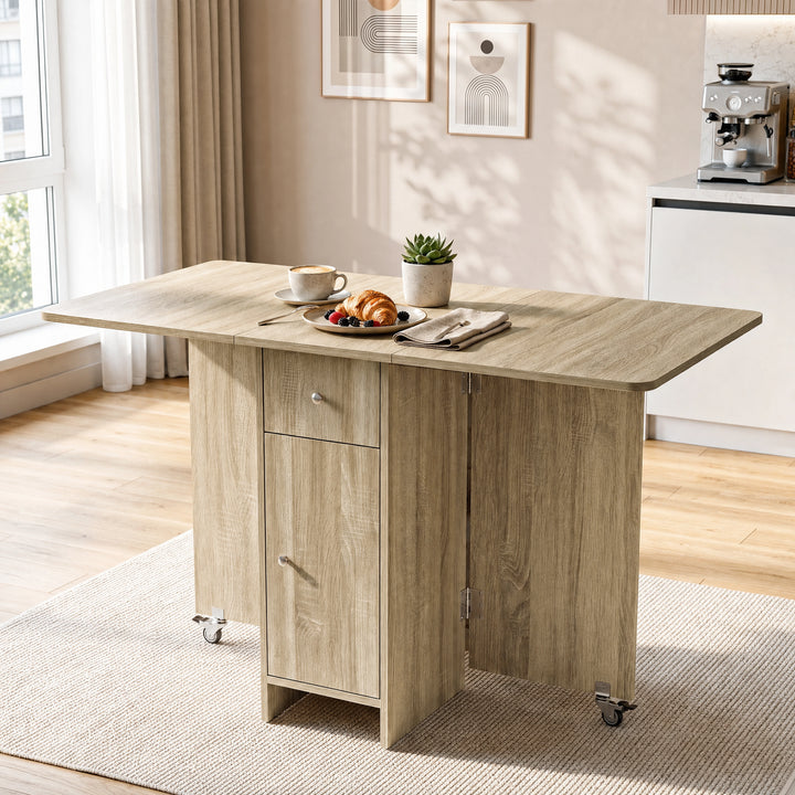[Sonoma Oak] Modern folding dining table fully opened and styled with coffee, croissant, berries, napkin and a potted plant.