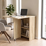 [Sonoma Oak] Compact folding dining table used as a desk with one leaf raised, laptop on it and rod-fronted side shelves view