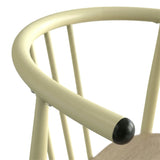 [Sonoma Oak] Torvi dining chair close-up showing green metal handrest of chair with black dome in the corner