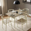 [Sonoma Oak] Torvi dining scene with four place settings, cream chairs, a textured rug, and a black pendant light.
