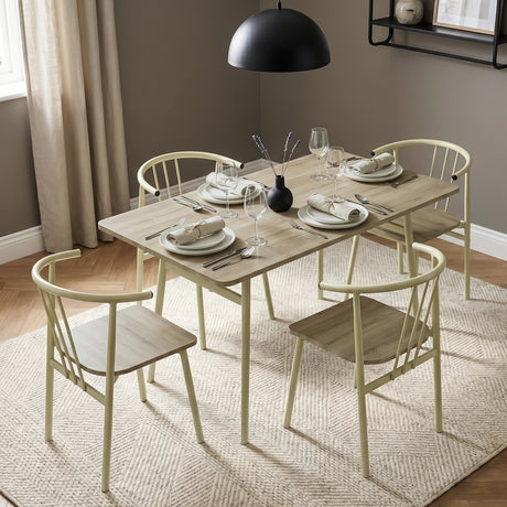 [Sonoma Oak] Torvi dining table and 4 chairs set in a styled dining room with pendant light, rug, and place settings on the oak-effect tabletop