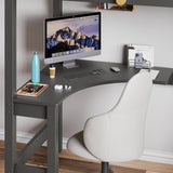 Space-saving corner workstation with neatly organised computer setup and a grey chair under the dark grey bunk bed