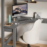 Space-saving corner workstation with neatly organised computer setup and a grey chair under the bunk bed.