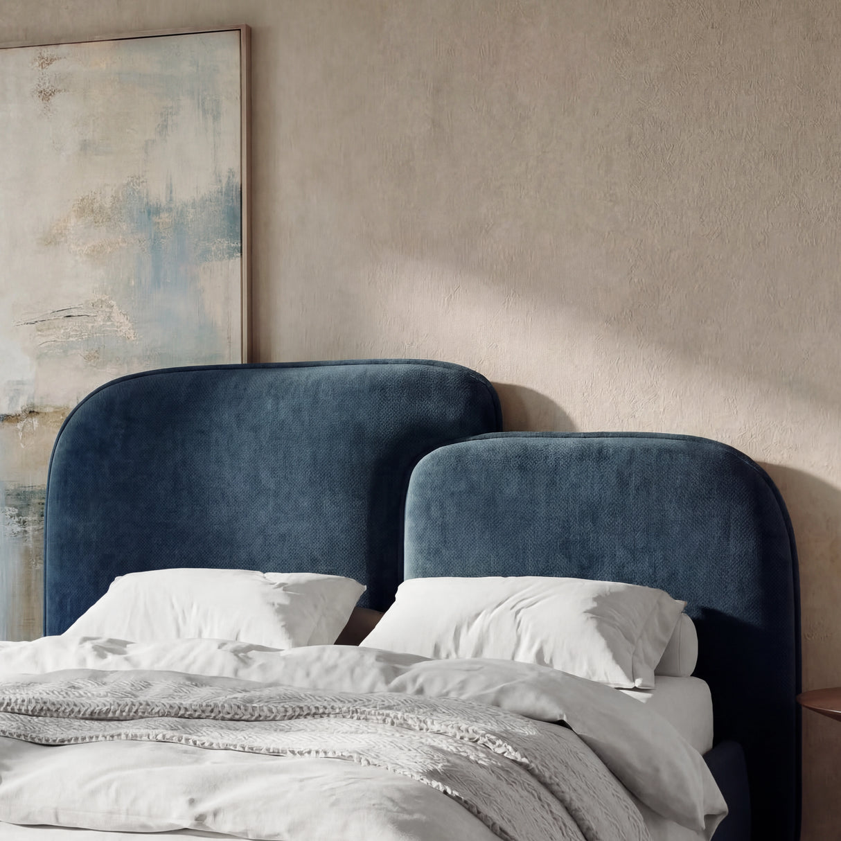 [Double | Blue] Close detail of split padded headboard sections showing rounded  corners and stitched fabric surface