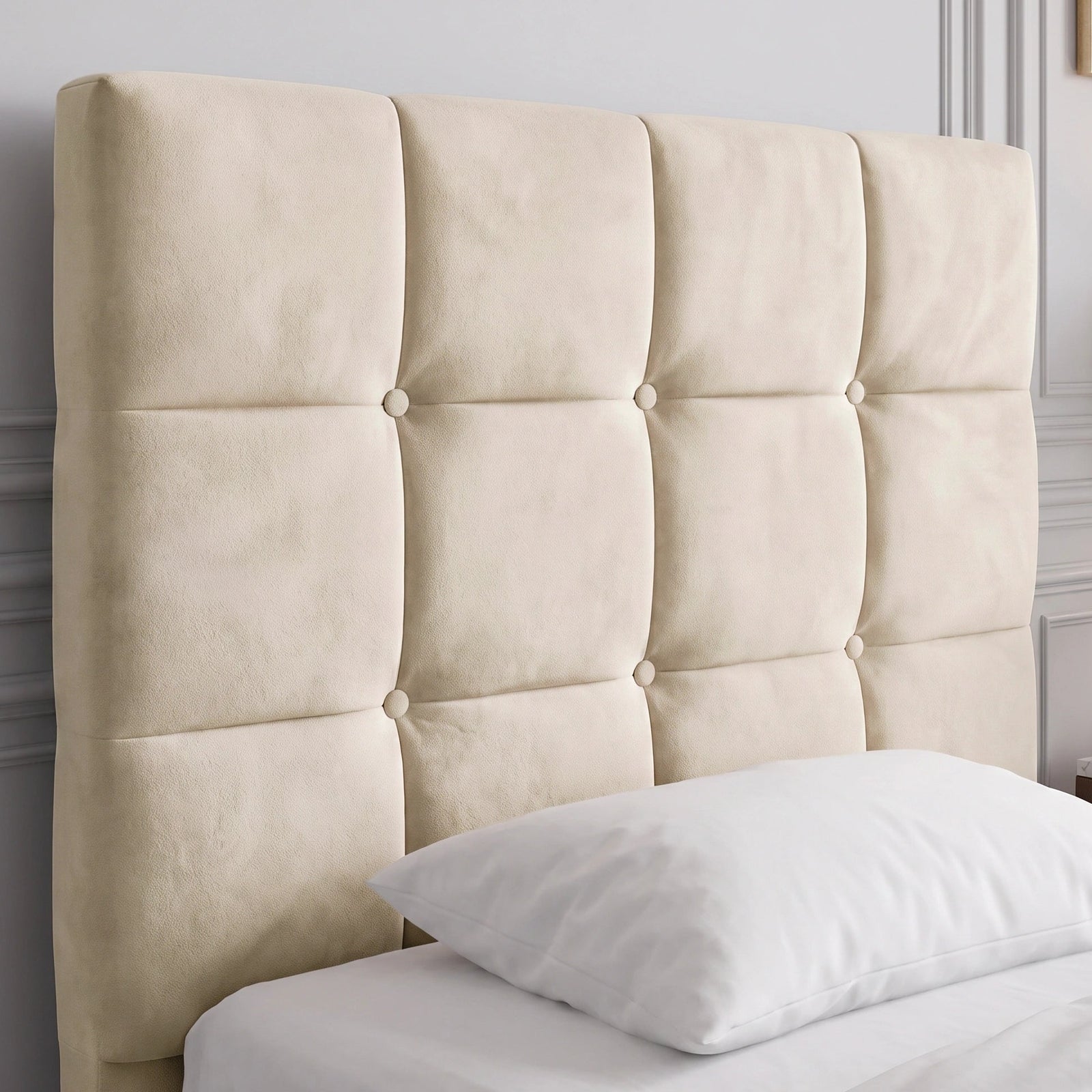 [Single | Beige] Close-up of beige velvet ottoman bed headboard with square button tufting and white pillow at the base