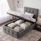 [Single | Dark Grey] tufted velvet storage bed with the mattress lifted open to show bedding and folded linens inside, styled in a bright modern bedroom with a nightstand, lamp, curtains, and framed wall art.