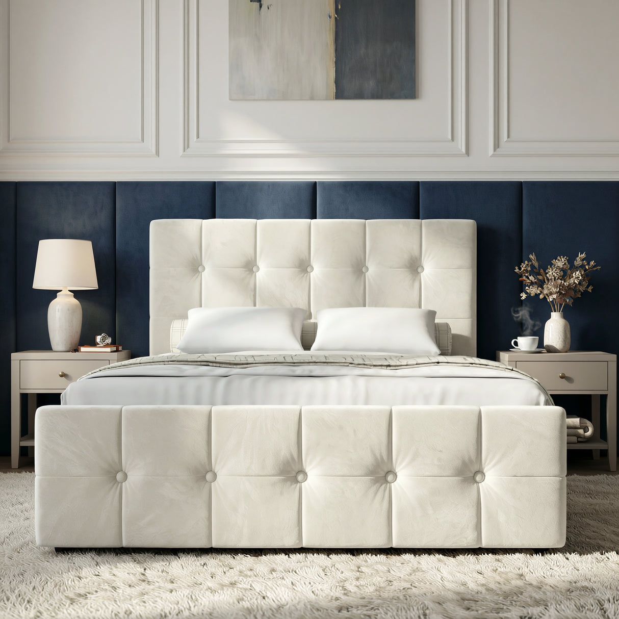 [Double | Beige] Front view of button-tufted ottoman bed centred between cream nightstands with abstract art above