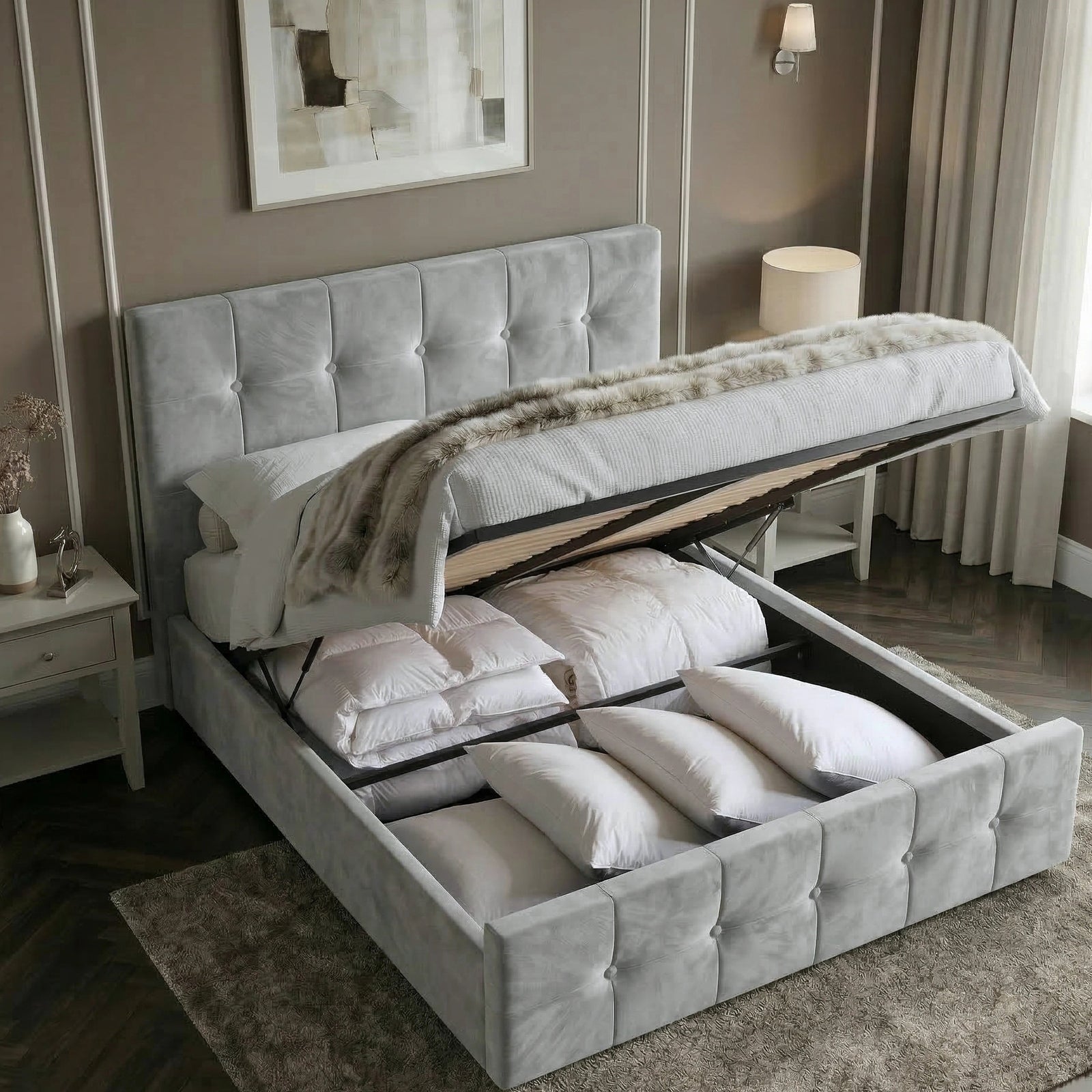 [Double | Grey] Ottoman bed lifted open showing deep storage with pillows and duvets in taupe moulded-wall room