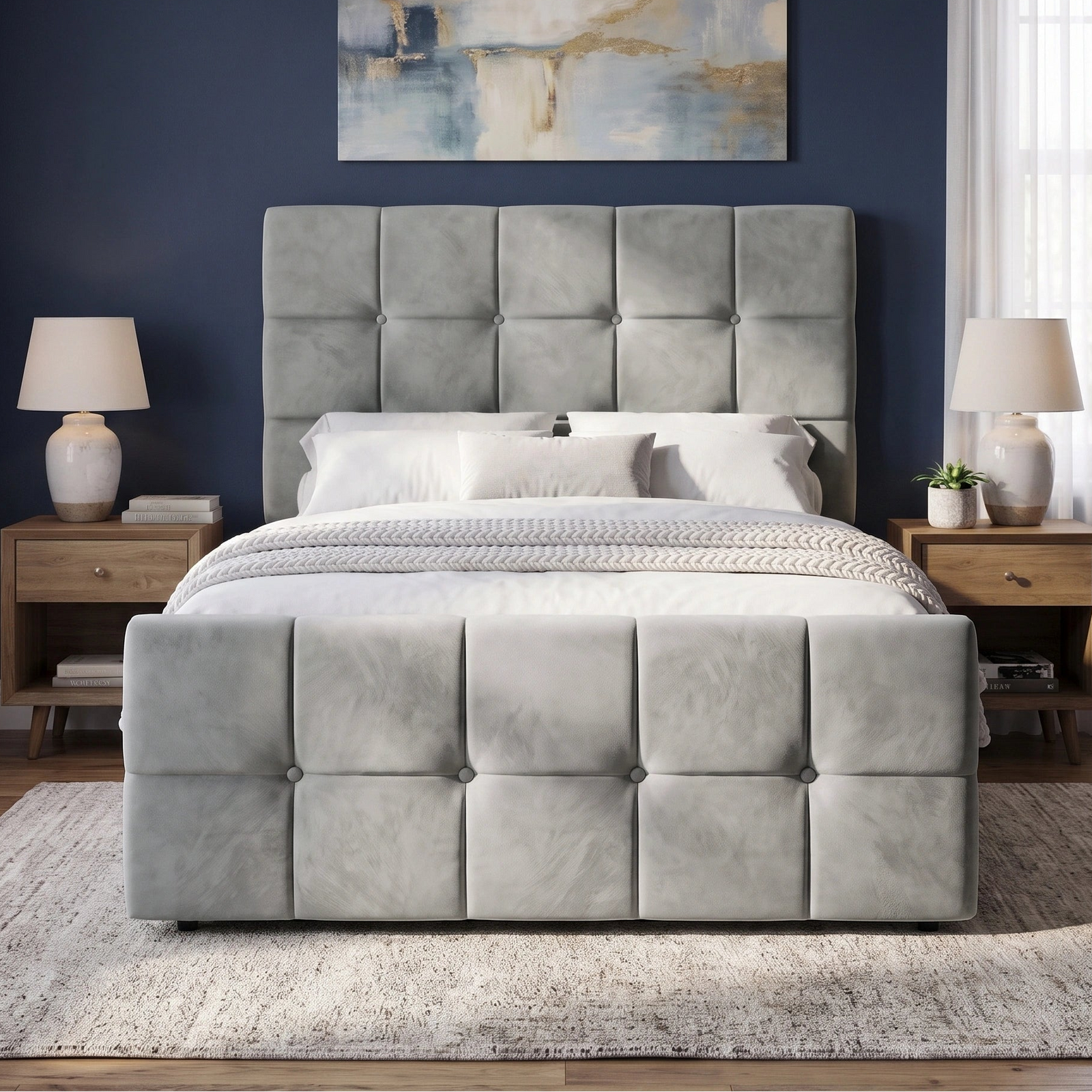 [Small Double | Grey] tufted velvet bed frame with a matching headboard and footboard, styled in a modern bedroom with a dark blue wall, wooden nightstands, and matching lamps.