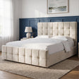 [King | Beige] upholstered bed frame with a tufted headboard and matching footboard, shown in a styled bedroom setting with white bedding, a beige throw blanket, marble nightstands, lamps, framed wall art, and a light rug.