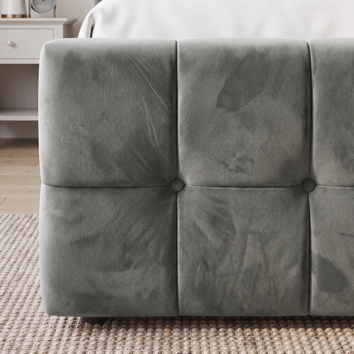 [King | Dark Grey] upholstered ottoman with a tufted grid design, shown in a bedroom setting with a bedside table visible in the background.