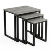 [Grey Wooden] Stackora set of 3 nesting tables angled view in a living room with sofa and accessories on grey tops