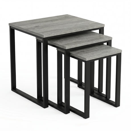 [Grey] Stackora set of 3 nesting tables angled view in a living room with sofa and accessories on grey tops