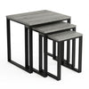 [Grey Wooden] Stackora set of 3 nesting tables angled view in a living room with sofa and accessories on grey tops