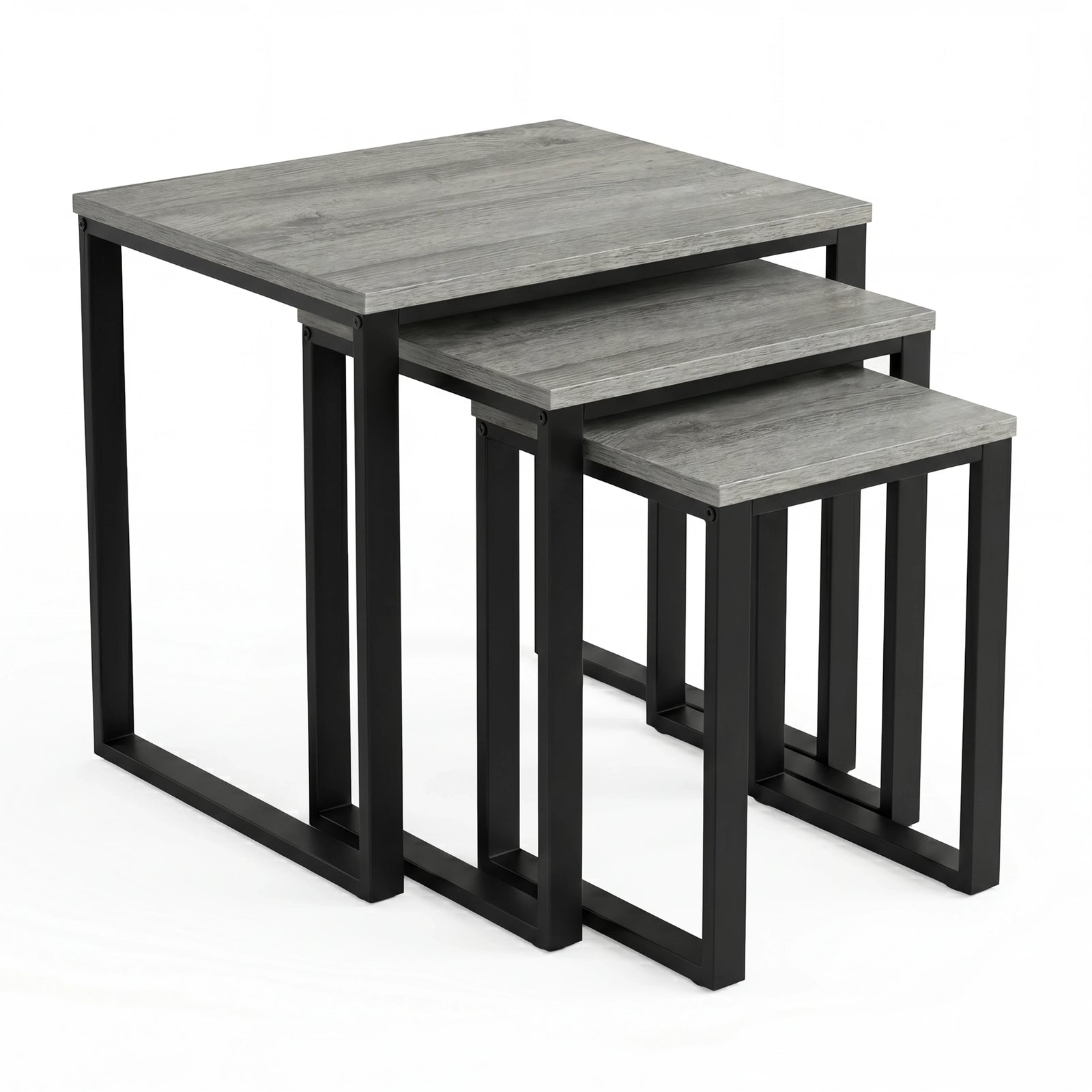 [Grey Wooden] Stackora set of 3 nesting tables angled view in a living room with sofa and accessories on grey tops