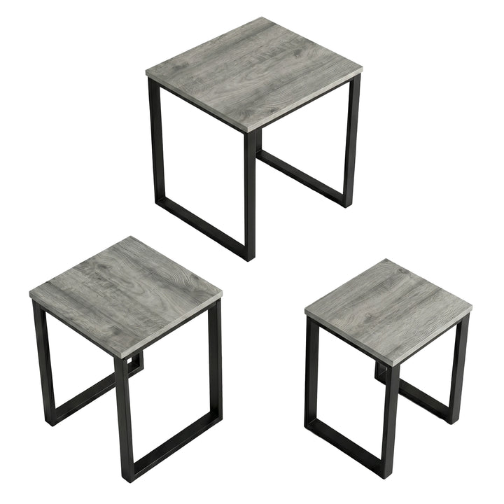 [Grey Wooden] Stackora set of 3 nesting tables angled 3/4 view on white background showing grey tops and metal frames