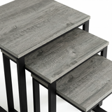 [Grey Wooden] Stackora nesting tables separated in a living room beside sofa with vase and plant on grey effect tops