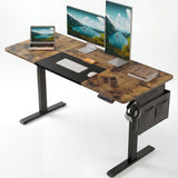 Rustic Electric Standing Desk with dual monitors, laptop, and accessories, featuring adjustable height and side storage for home office setup.