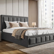 Gray upholstered bed with white bedding and beige pillows in a modern bedroom.