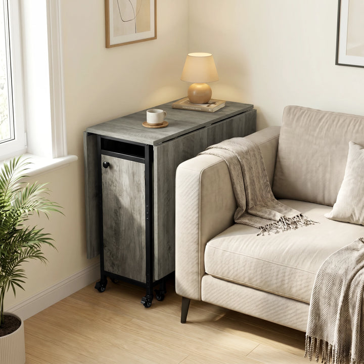 [Wooden Grey] Kitchen & Dining Furniture Sets folded table parked beside a sofa with lamp, cup, blanket, and window light.