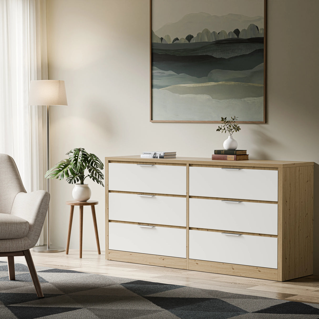 6-drawer chest of drawers placed against a wall in a bright living space with a patterned rug, a lamp, and a side table