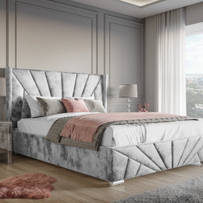 Crushed Velvet Ottoman Storage Bed Silver -Sunrise Bed Frame features a luxurious silver crushed velvet finish with end lift-up storage and elegant panel design.