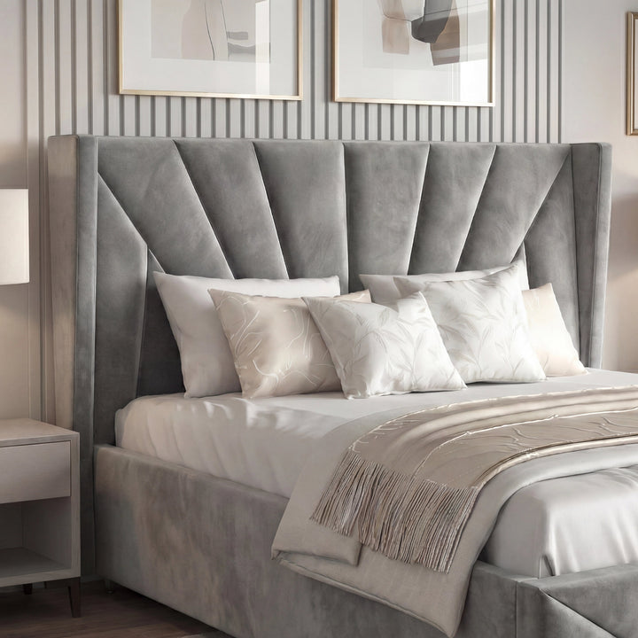 [King | Dark Grey] Detail of dark grey sunburst headboard showing deep velvet channels with cushions and fringed throw