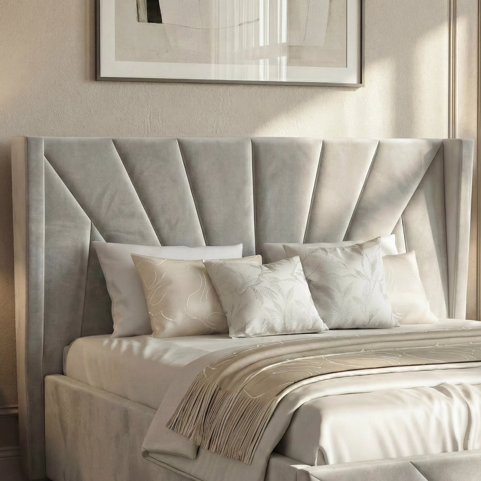 [King | Grey] Detail view of grey sunburst headboard showing deep velvet channels with botanical cushions below