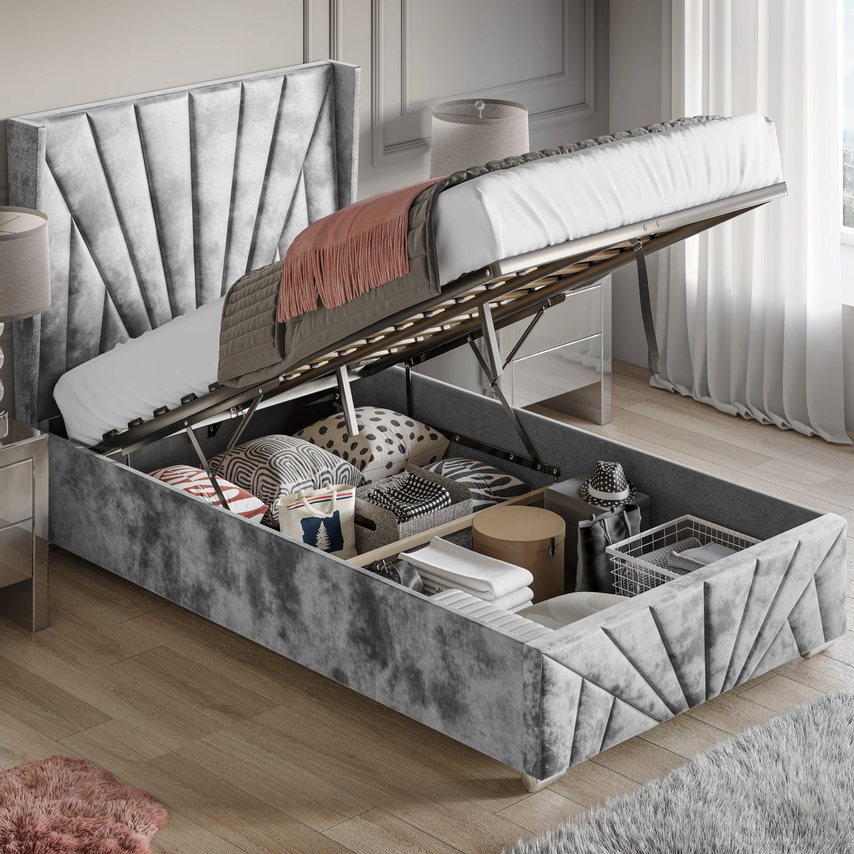 Crushed Velvet Ottoman Storage Bed Silver Sunrise Bed Frame with end lift-up mechanism, showcasing spacious under-bed storage filled with bedding and boxes.