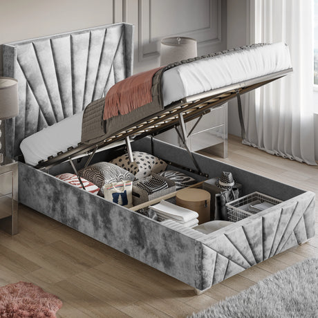 Crushed Velvet Ottoman Storage Bed Silver Sunrise Bed Frame with end lift-up mechanism, showcasing spacious under-bed storage filled with bedding and boxes.