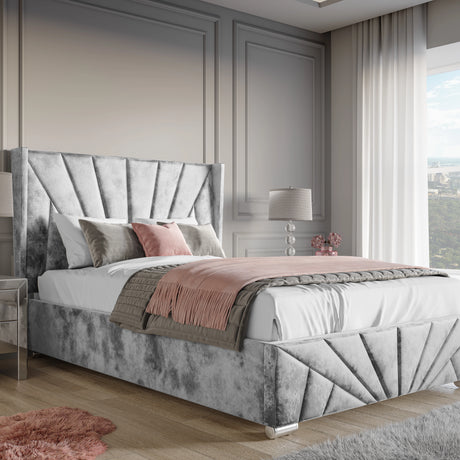 Crushed Velvet Ottoman Storage Bed Silver Sunrise Bed Frame with end lift-up storage, featuring a tall paneled headboard in a modern bedroom setting.