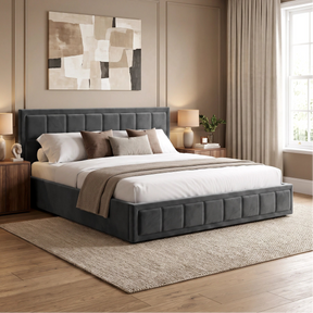 [Super King | Grey] platform bed with a dark gray tufted upholstered headboard and matching footboard, styled in a contemporary bedroom with wood nightstands, lamps, beige curtains, and a neutral abstract wall art piece.