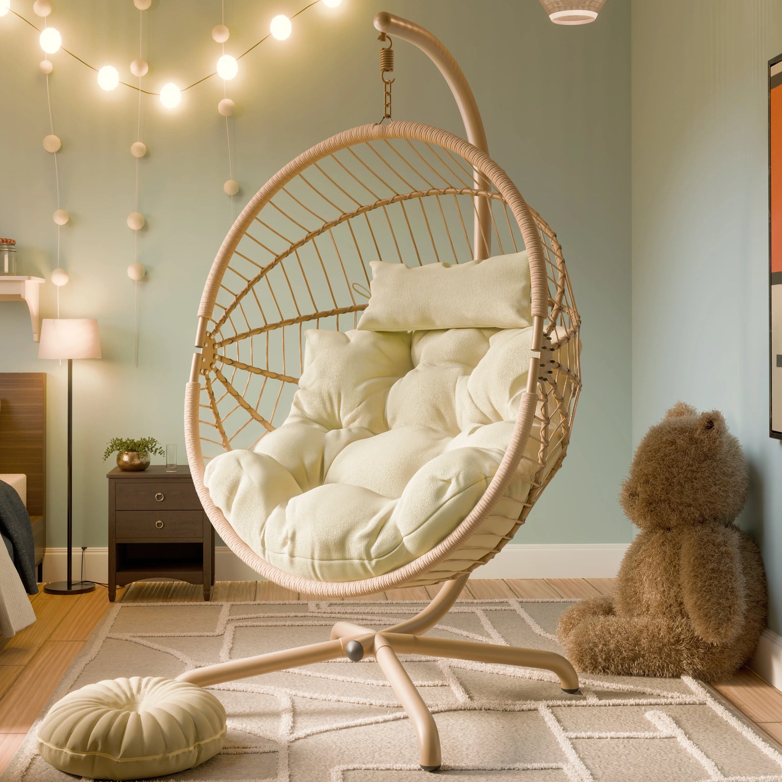 [Beige] Beige wicker egg chair beside bed and side table, cream cushions and pouf on patterned rug