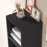 Top view of black 5 tier bookcase with decor, showcasing matte finish and clean lines.