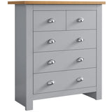 Tall modern chest of drawers with sleek handles, offering stylish and spacious bedroom storage