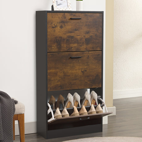 Rustic shoe storage unit in a 3 tier shoe cabinet style, decor placed on top and shoes stored in the bottom drawer.