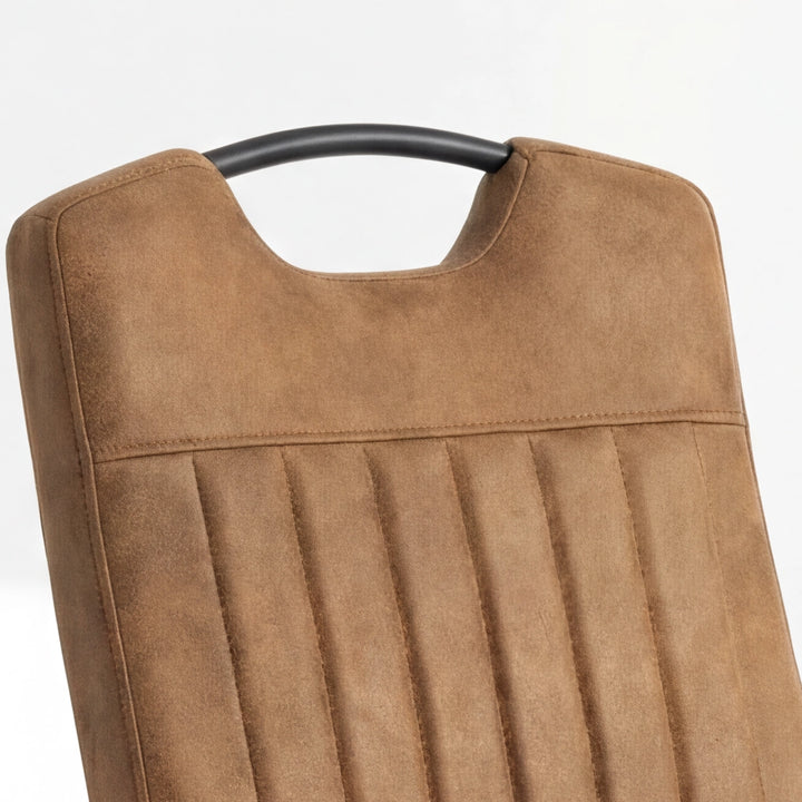 [Tan] Close-up of tall upholstered back with stitched seams, vertical channels and black carry grip.