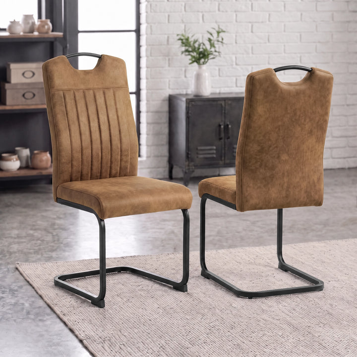 [Tan] Front and rear views of high-back upholstered dining chairs with carry grips and black loop metal frames.