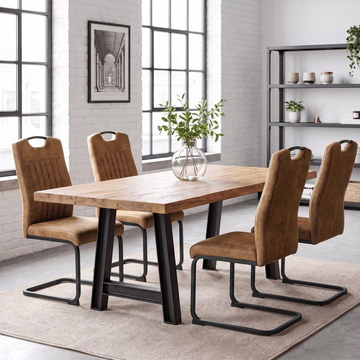 [Tan] Four high-back dining chairs with black loop metal frames around a wood table styled with a glass plant vase.