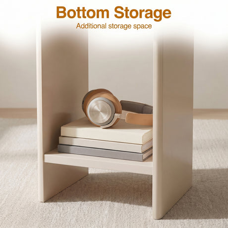 [Taupe] Small Round Side Table with Shelf Living Room close-up of lower storage shelf between panel legs holding stacked books and headphones on beige rug