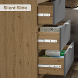 Close-up of three partially open bedroom chest of drawers in grey and oak finish, showing the smooth metal drawer hardware