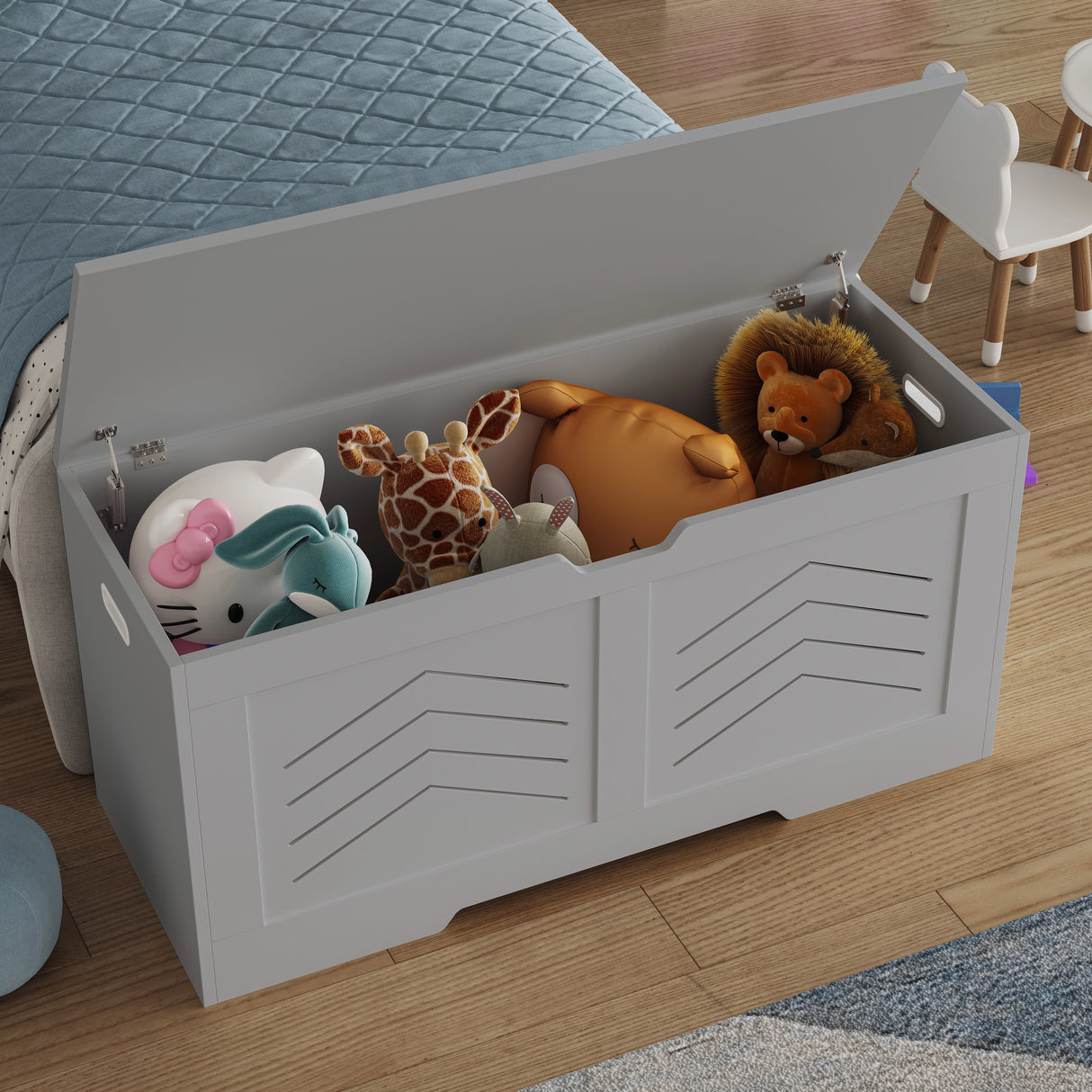 Storage Chest - Wooden Box With Lid For Blankets, Clothes or Toys in grey with arrow design, filled with stuffed animals in a child's bedroom.