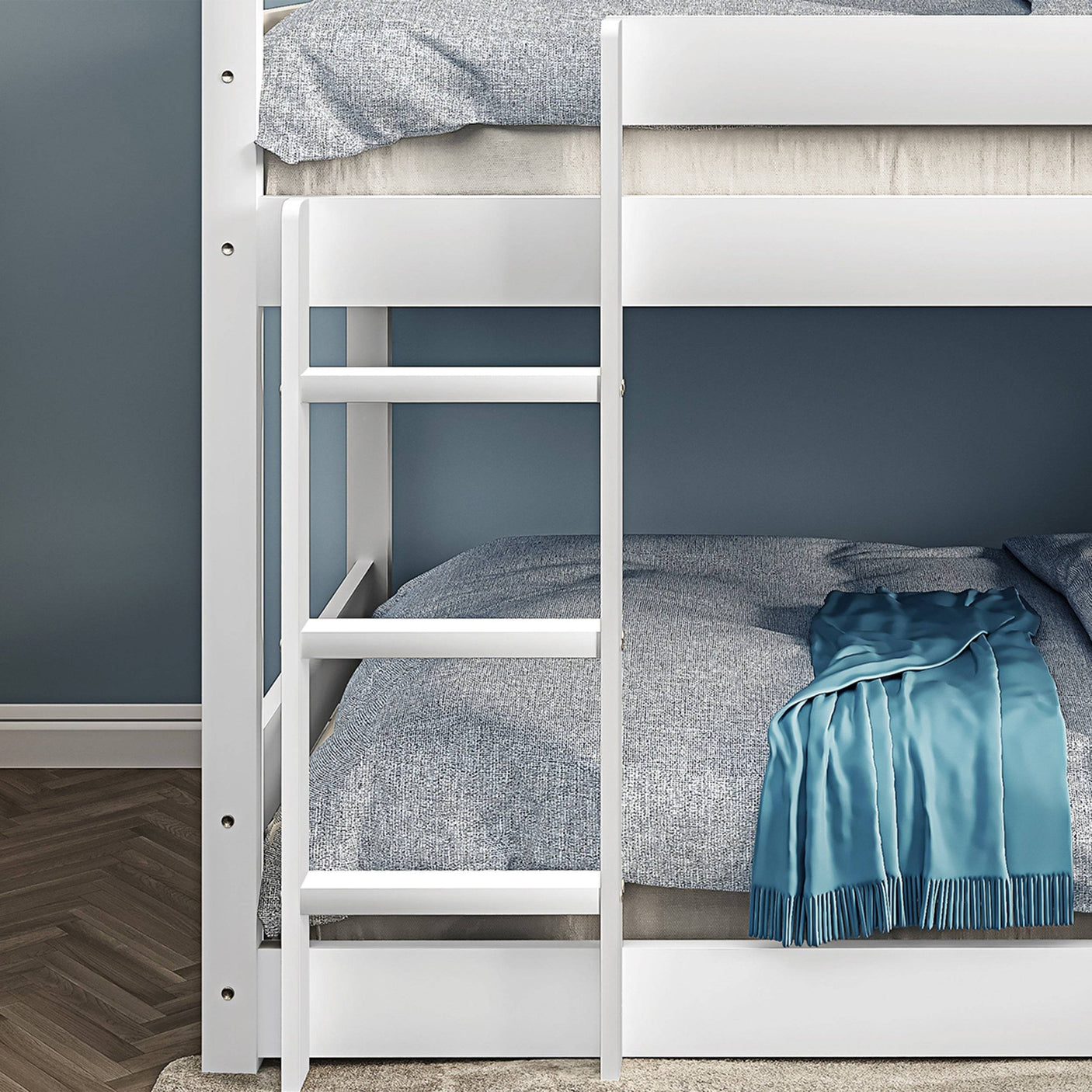 Close-up of lower ladder on white triple bunk bed, highlighting easy access and child-safe design.