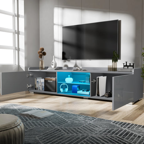 Modern living room with a large TV mounted on the wall above a gray entertainment console.